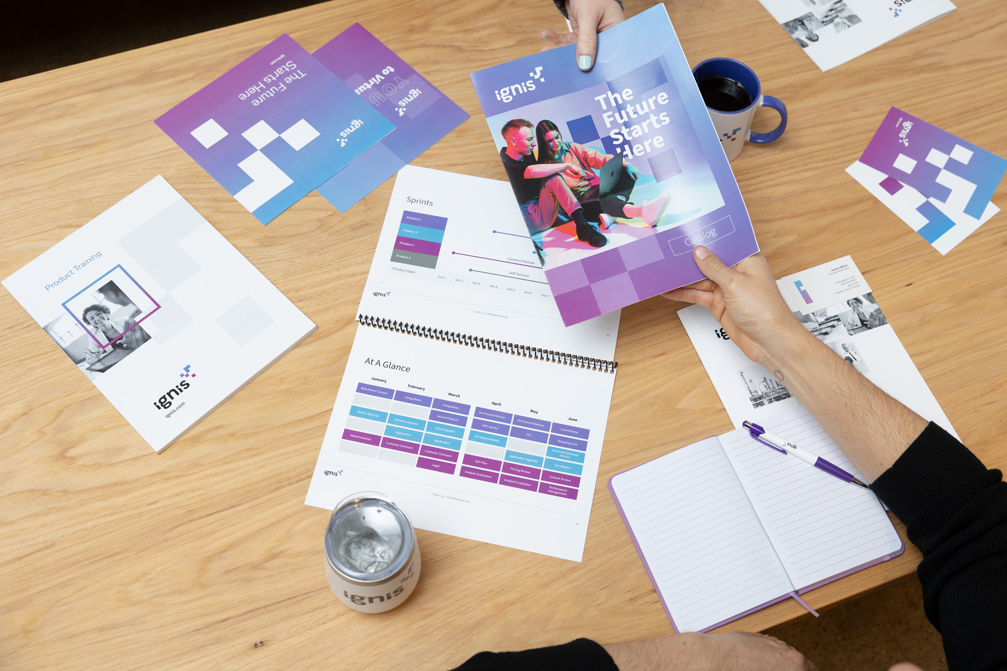 coworkers viewing printed sales products