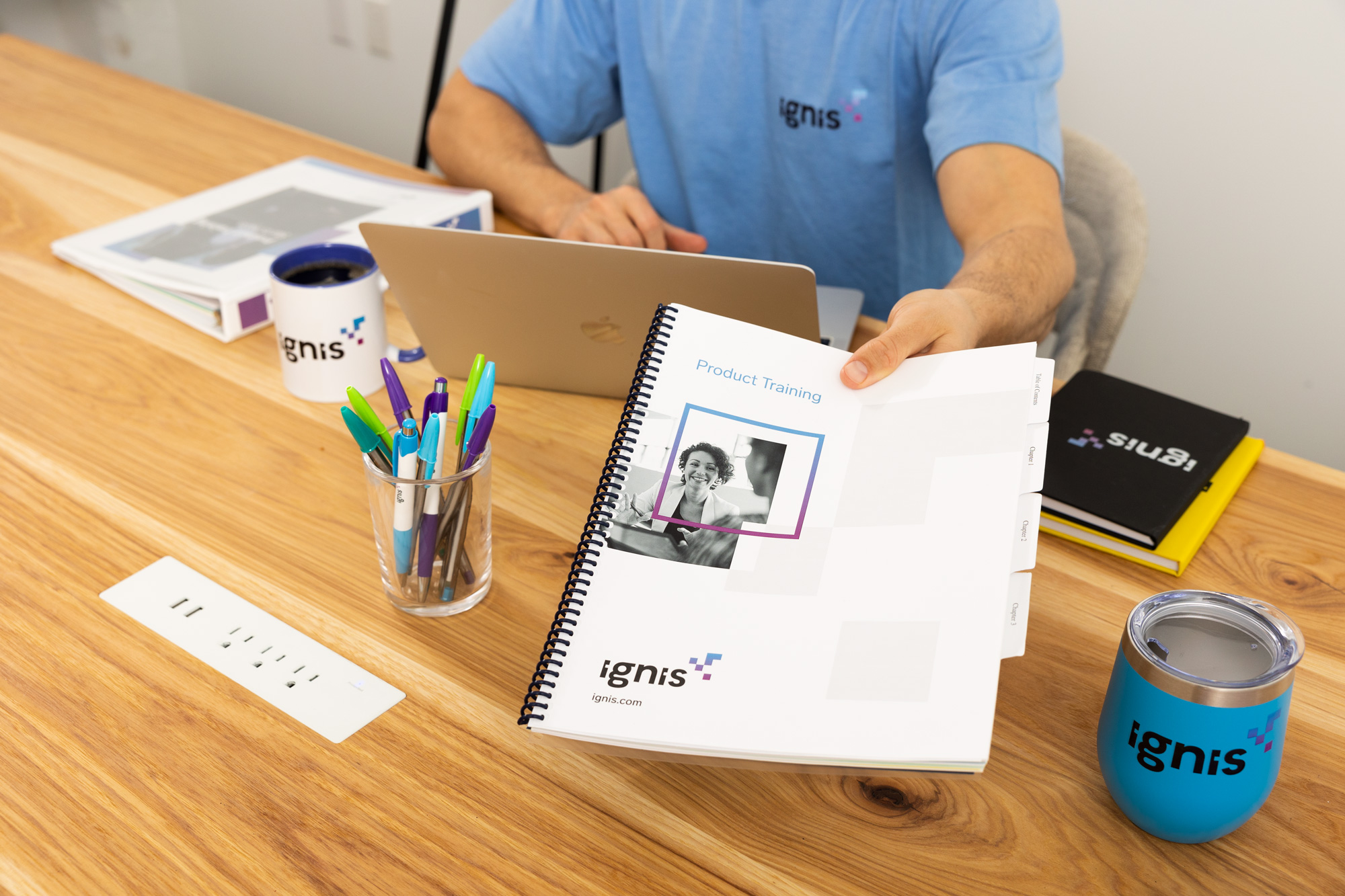 trainer handing printed training manual