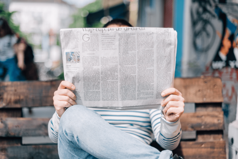 man reading paper