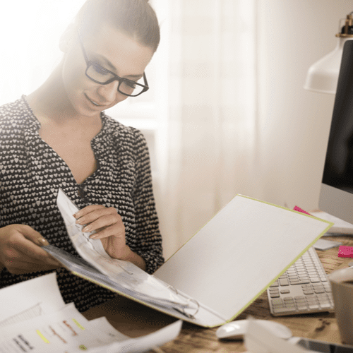 woman browsing 3 ring binder