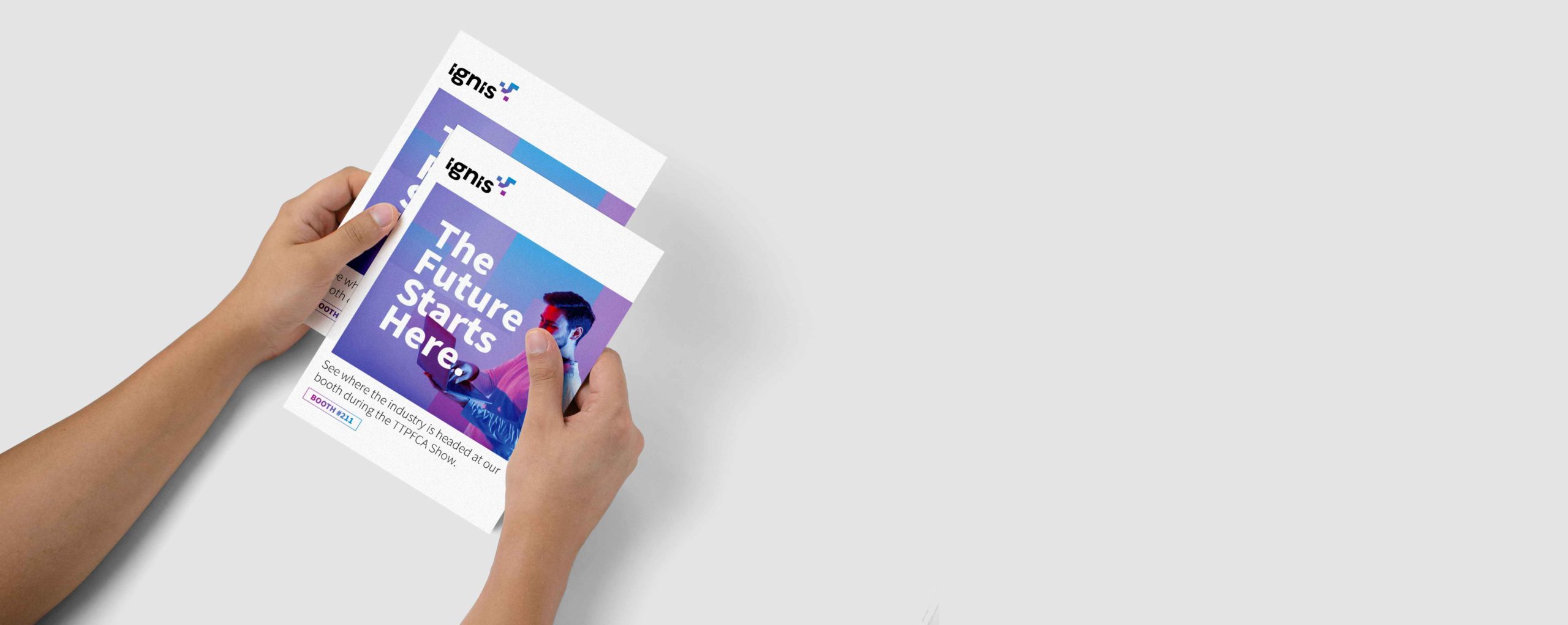 A person holding 2 colorful flyers