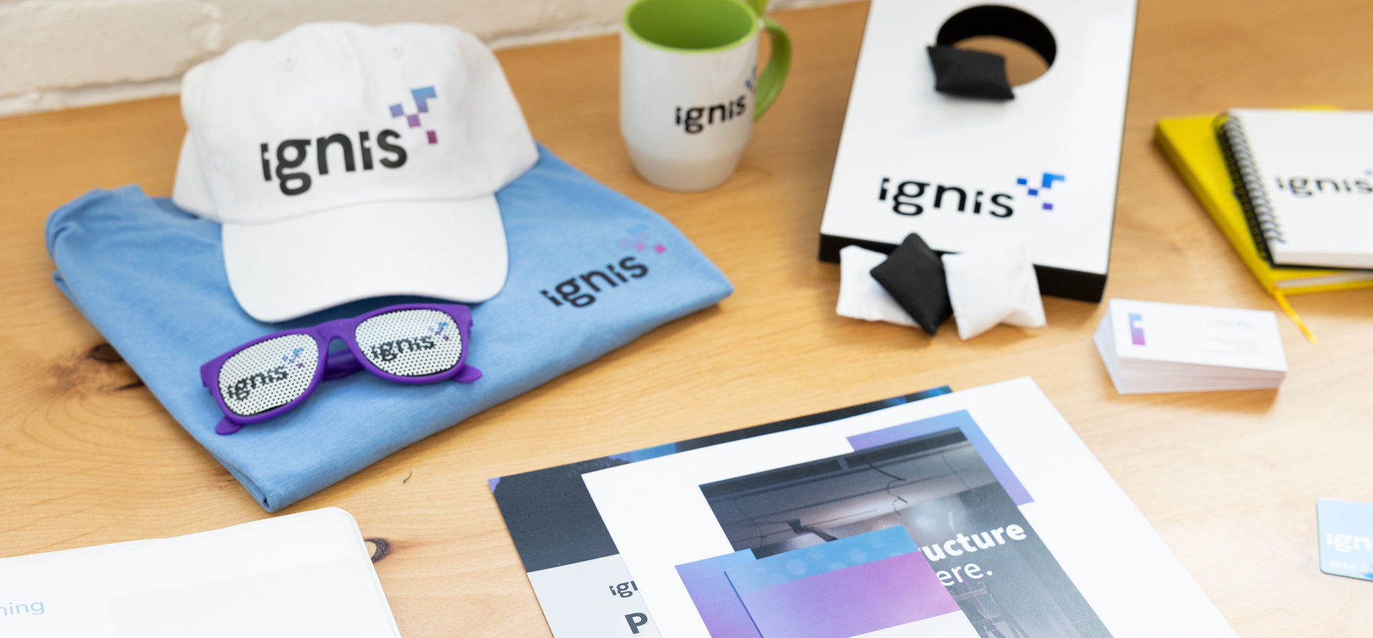 branded merchandise and printed products lay on a desk