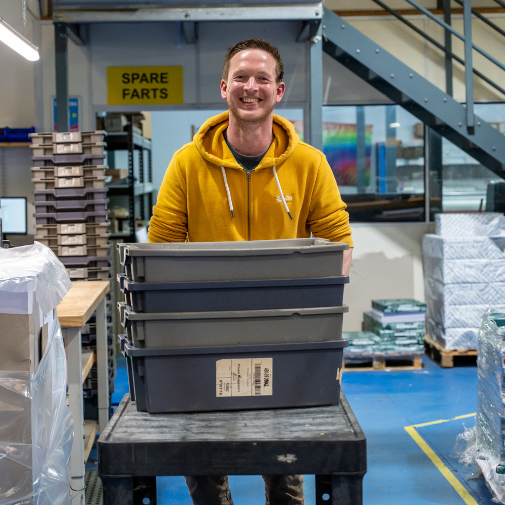 mimeo staff member in print warehouse