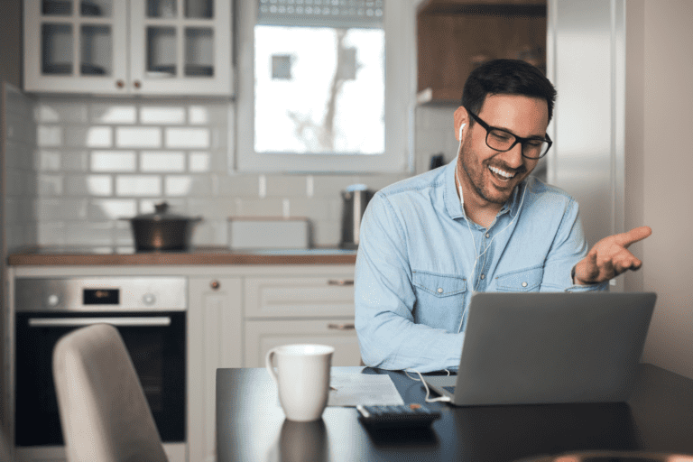 man video conferencing with laptop