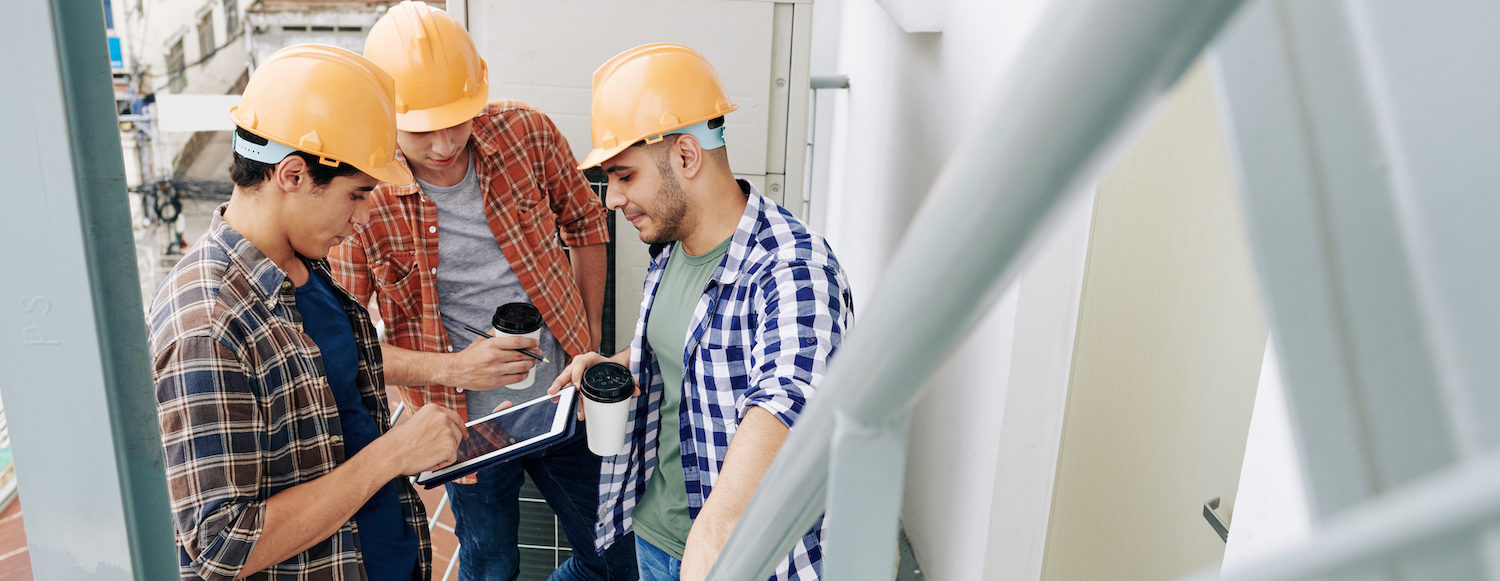 construction workers using ipad