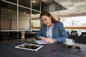 woman closing reviewing and proofing RFP response