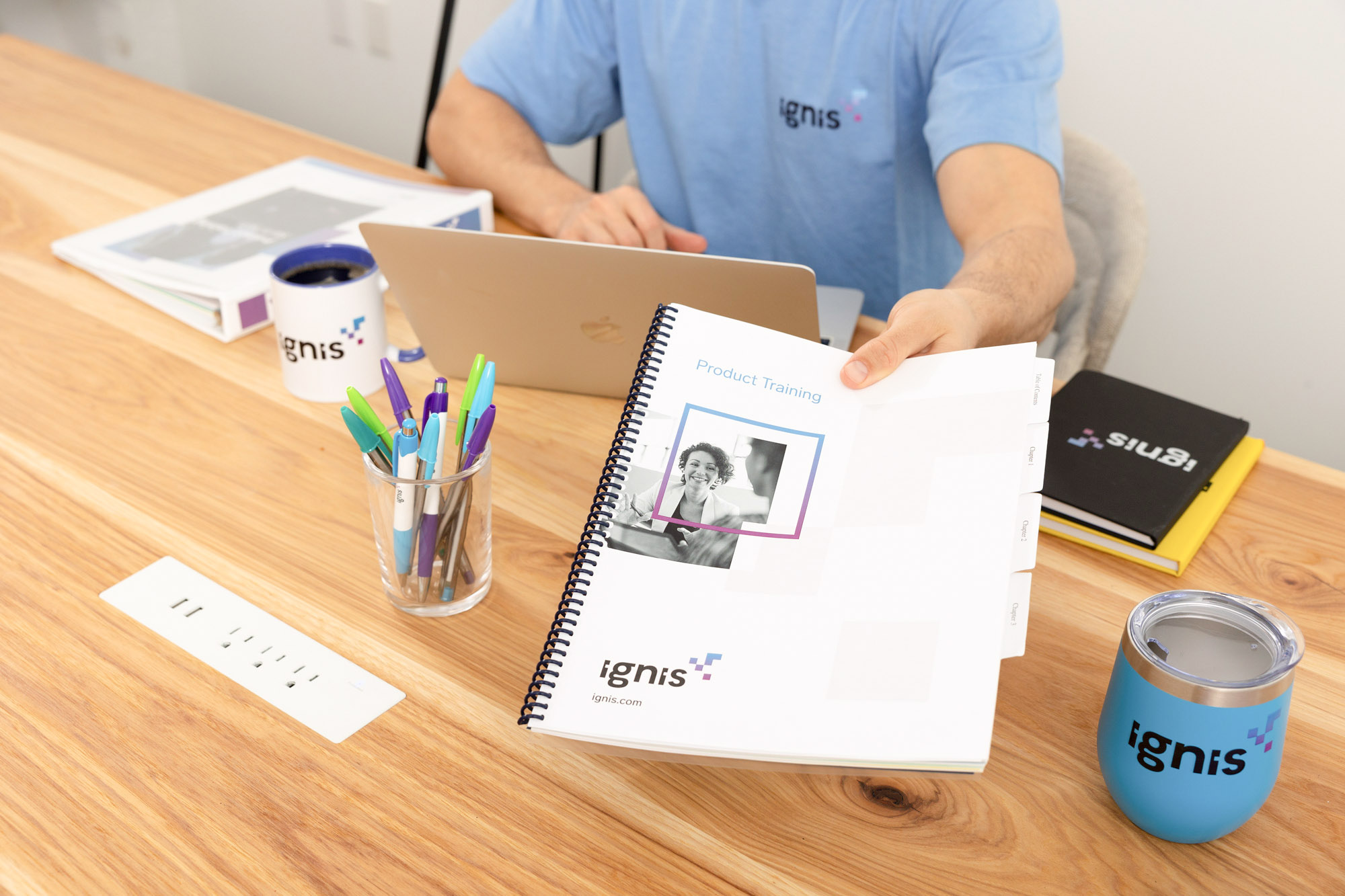 trainer handing printed training manual