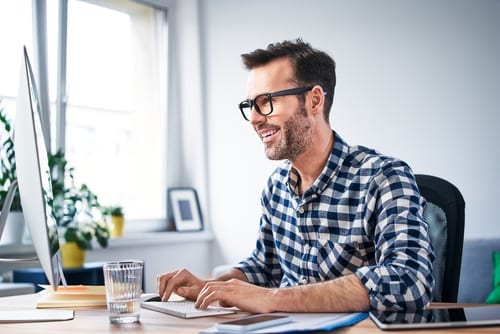 man looking at savings from swtiching to print on-demand