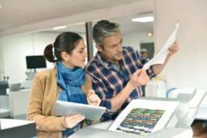 man and woman struggling at traditional print shop