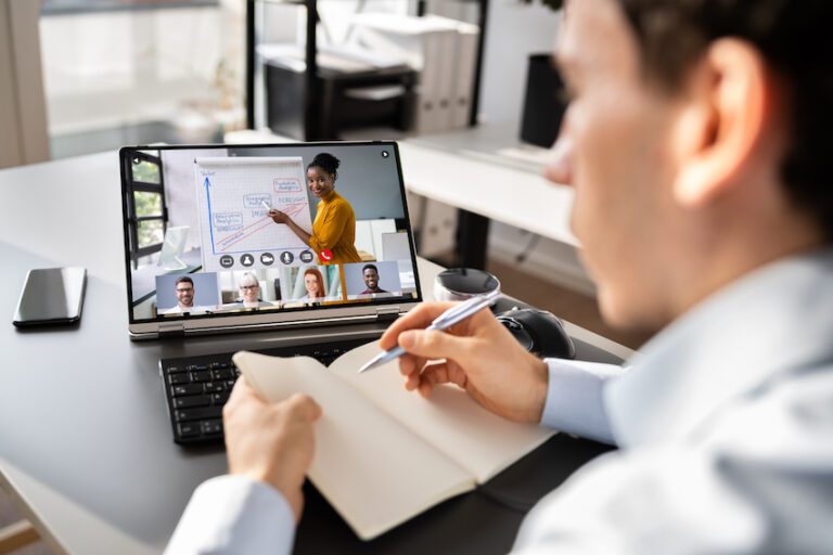 man on remote training session on laptop