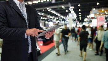 man with tablet at trade show