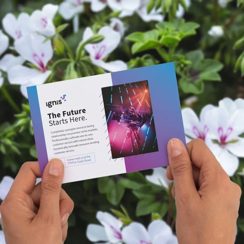 person hoding a printed postcard with both hands