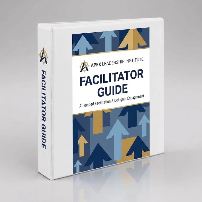 A white training binder with "facilitator guide" on the front